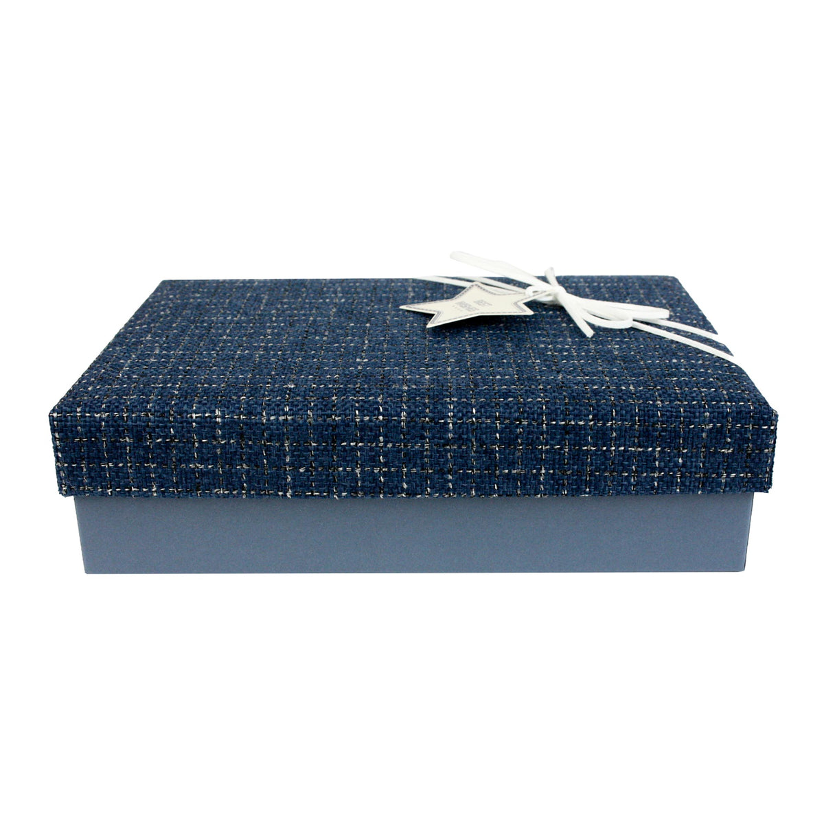 Blue textured gift box with white ribbon on a shelf with other decorative boxes